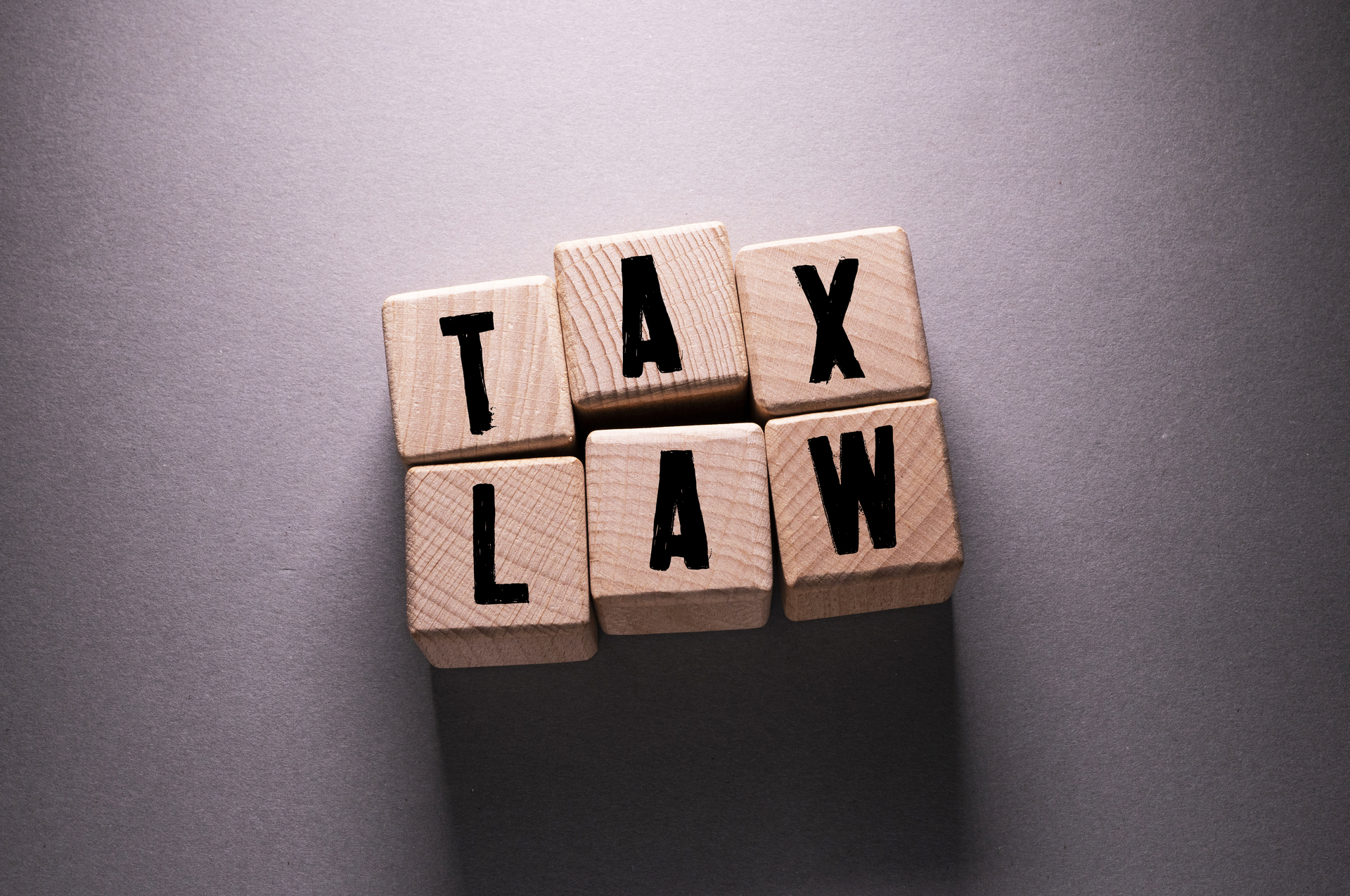 tax law word with wooden cubes